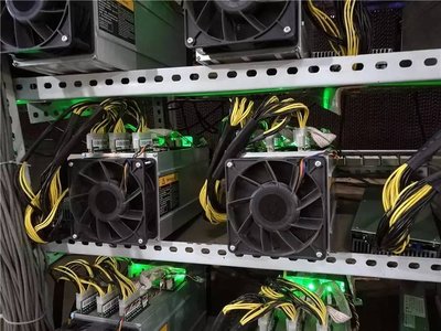 A large solar panel farm powering a data center containing mining equipment